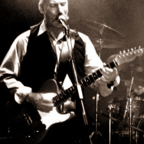 Tommy Fyfe on mic with guitar rocking Lavigne Tavern.