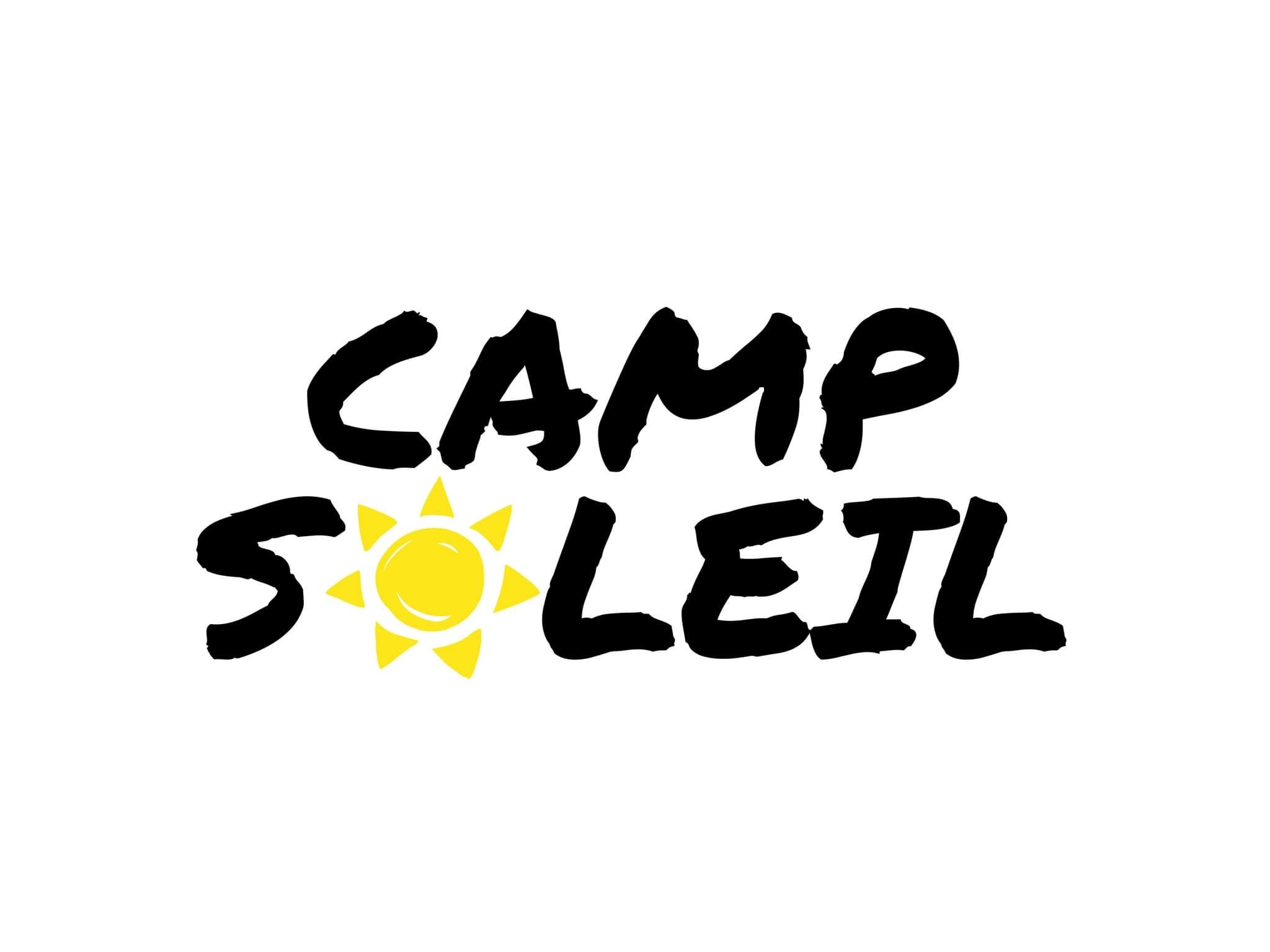Yellow sun with a smile, logo for Camp Soleil.