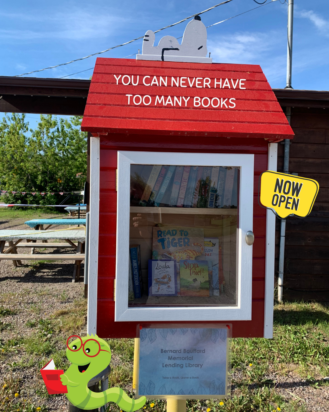 Lending Library - Bernard Bouffard Memorial - red dog house style with book shelves.
